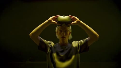 Young Adult Puts on Virtual Reality Headset