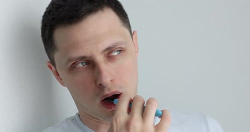 Man Brushing Teeth with Toothbrush Hygienic Routine