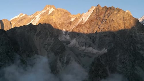 Majestic Snow-Capped Mountains at Golden Hour