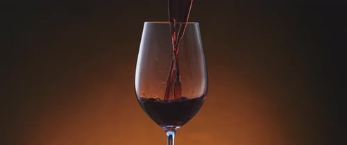 Pouring Red Wine into Glass Close Up