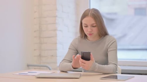 Woman On Video Call at Her Desk