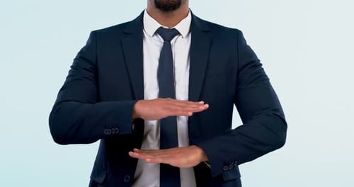 Hands, size and measure with a business man closeup in studio on a blue background for planning