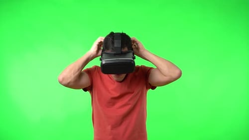 Excited Man Enjoys Virtual Reality on Green Screen