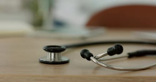 Stethoscope, table or medical equipment in empty office for cardiology, heartbeat test