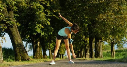 Woman Stretching in Rural Nature Setting