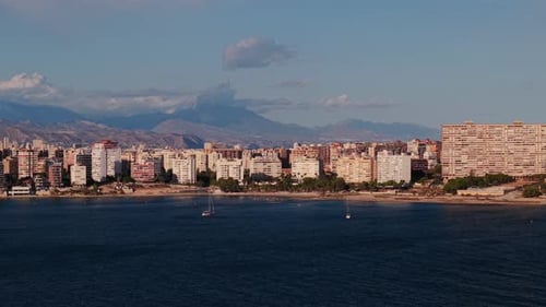 Coastal View of Alicante with Modern Residential Buildings Sandy Beach and Sailing Boats on the