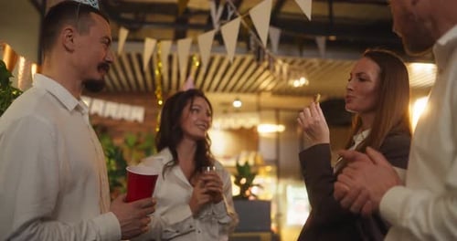 Adults Celebrating Birthday at Indoor Party