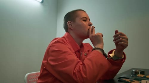 Female Inmate Smoking Cigarette during Interrogation