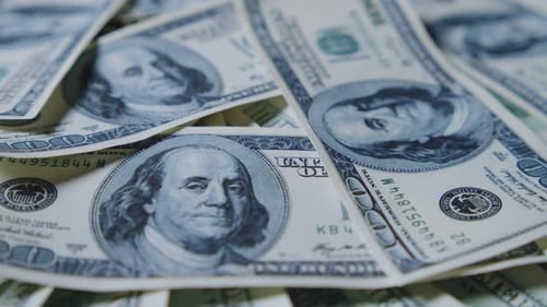 US One Hundred Dollar Bills in Slow Motion CloseUp for Financial Themes