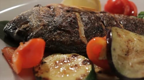 Close Up of Grilled Fish with Vegetables