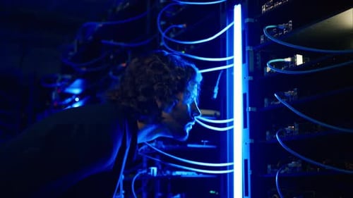 Man analysing servers in a data center