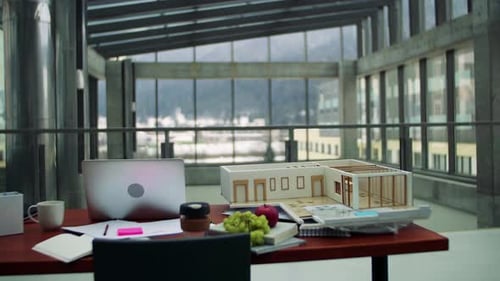 Interior of an Office of an Architect, Laptop and Model of A