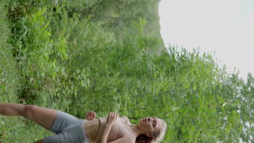 Woman Athlete Long Blonde Hair on a Morning Jog Running in the Forest