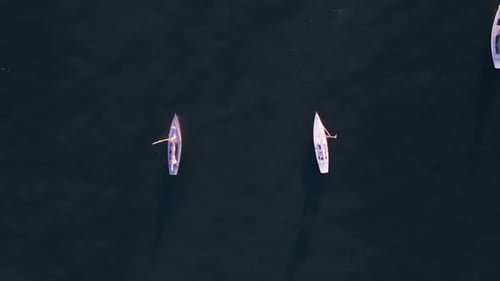 Aerial view of serene beach and boats, United States.