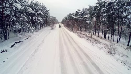 Winter Traveling Car. Road Covered With Snow