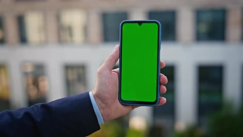 Businessman Finger Tapping Mockup Cellphone Message at Modern District Closeup