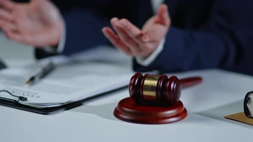 Close Up of Gavel and Judge in Courtroom