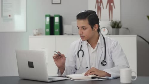 Indian doctor studying for exams