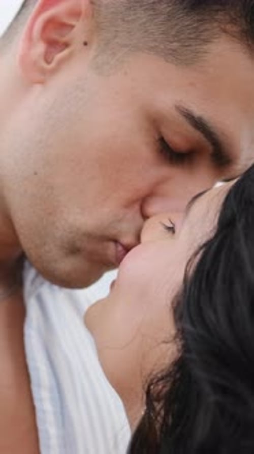 Romantic Young Couple Kissing Affectionately