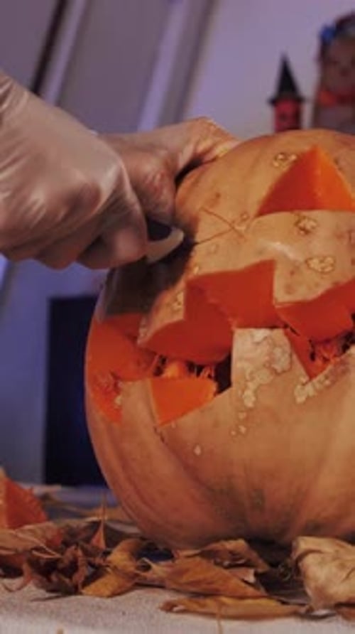 Halloween Pumpkin Carving CloseUp Knife Cutting Jacko'Lantern Vertical Video