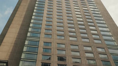 Low Angle View of a Modern Office Building Facade Against the Sky in the City Center Business and
