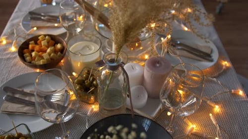 Festive Table Setting with Appetizers and Candles