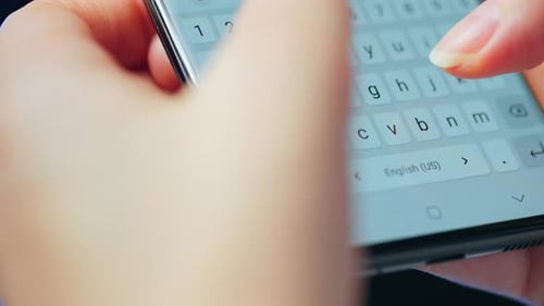 Close Up of Hands Typing on a Smartphone