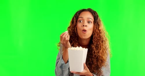 Excited woman, popcorn and green screen eating movie snack and watching tv