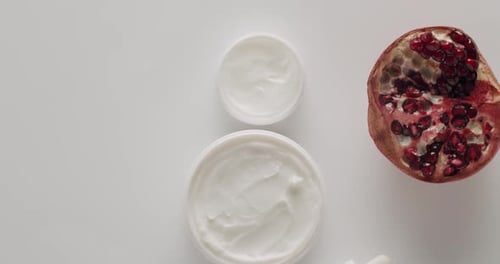 Jars of Cream and Pomegranate Beauty Theme