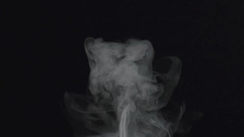 Wispy White Smoke Rising on Black Background