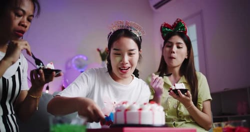 Young Women Celebrating Birthday at Home With Cake
