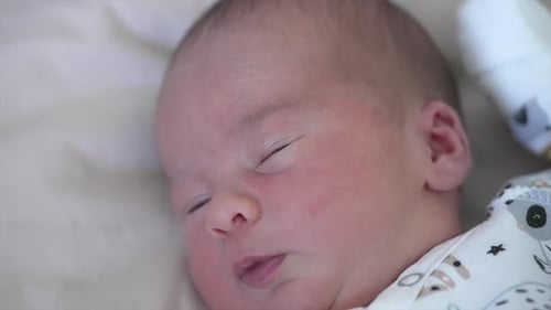 Newborn Baby Sleeping Peacefully at Home