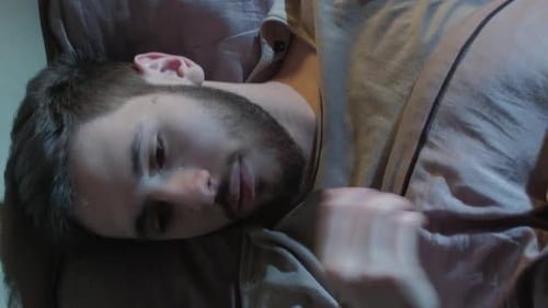 Man Sleeping and Waking Up in Bed