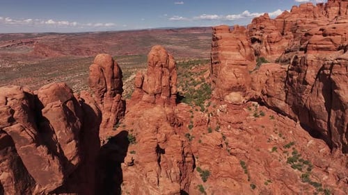 Drone view of the striking red rock formations in Moab, capturing the unique geological features