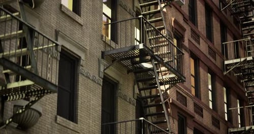 Night Scene of Urban Apartment Buildings with Fire Escapes