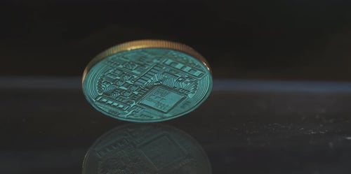 Bitcoin Cryptocurrency Coin Spins with Fire Behind