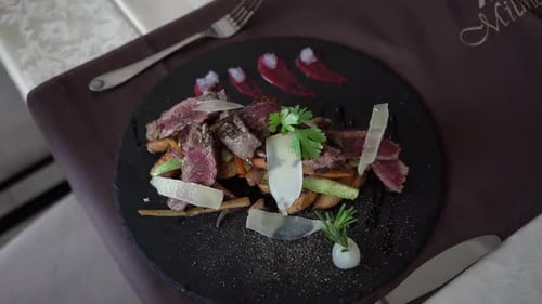 Gourmet Dish: Sliced Meat with Roasted Vegetables
