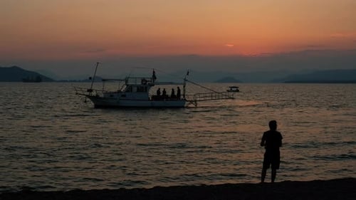 Tranquil Sunset Fisherman with Silhouetted Boat Trip