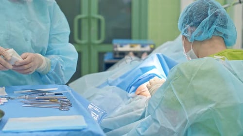 Surgeons Performing an Operation in Operating Room