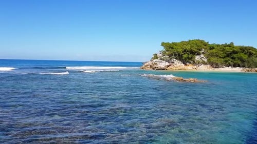 Aerial View of a Small Island in the Ocean Showcasing Its Beauty