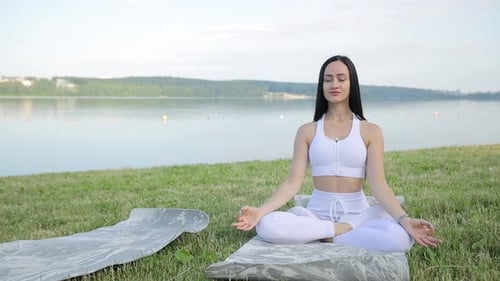 Woman Meditating in Nature Lotus Pose Healthy Lifestyle Meditation Concept