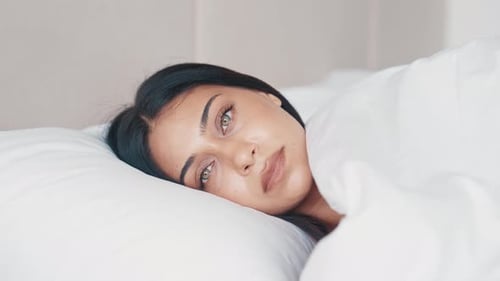 Woman Sleeping then Waking Up in White Bed