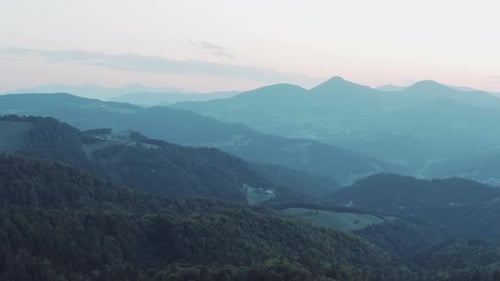 Aerial drone view flight over forest in Mountain with blue sky.