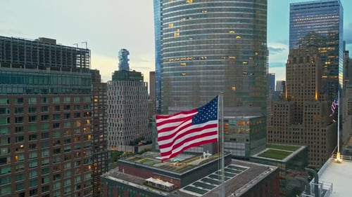 American Flag Waving Proudly in a Vibrant Cityscape
