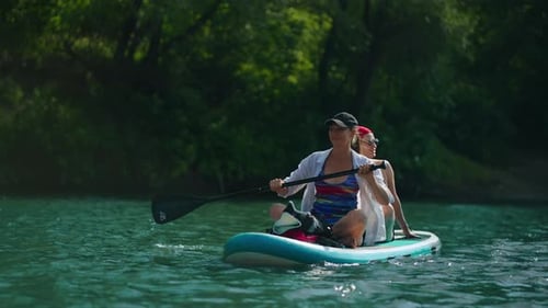 Women Floating On Stand Up Paddle Board In River In Summertime Active Rest In Nature