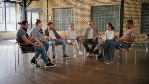 Diverse People Taking Hands in Circle Promoted By Therapist