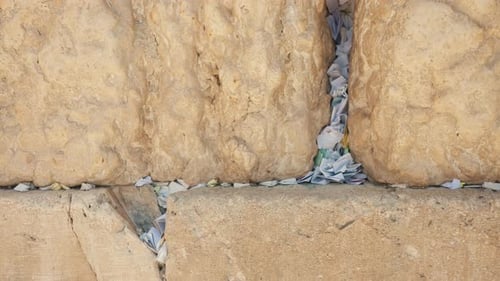 Western Wailing Wall with prayer notes in Jerusalem Israel