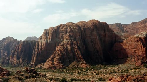 Beautiful aerial drone landscape nature shot of stunning red rock formations with dried petrified sa