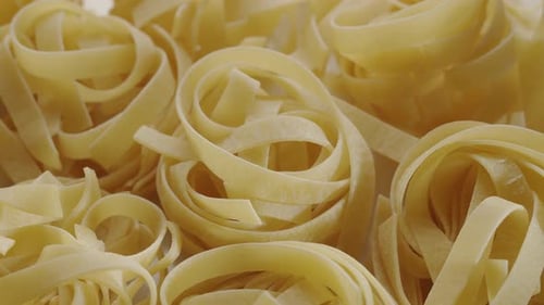 Close Up of Uncooked Rolled Tagliatelle Pasta