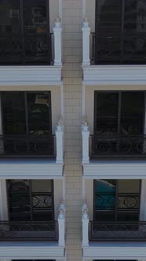 Vertical Video Mediterranean Seafront Home With White Facade Azure Pool and Stunning HighEnd